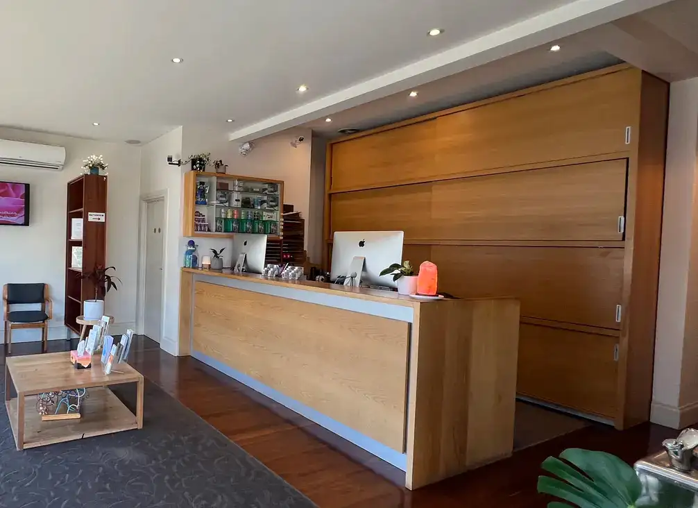 The reception desk, seating and product shelves inside the clinic