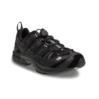 The Dr. Comfort Performance men's cross-trainer in black, outside profile showing the toggle lace and the mesh panels