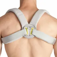 A grey clavicle strap worn on a bare back, the padded shoulder loops meeting at a central pad where two side straps thread through D-rings