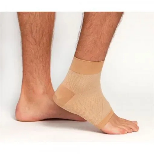 The tan colourway on a bare foot, seen from the side