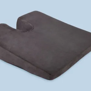 A square grey foam seat cushion with a U-shaped cut-out in the back edge