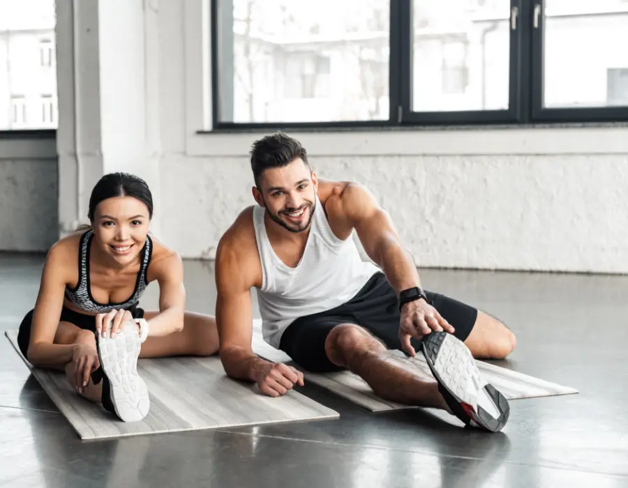 Athletes stretching with support from a sports chiropractor in Melbourne