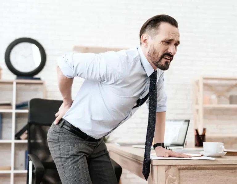 Man with severe lower back pain seeking Chiropractor Melbourne