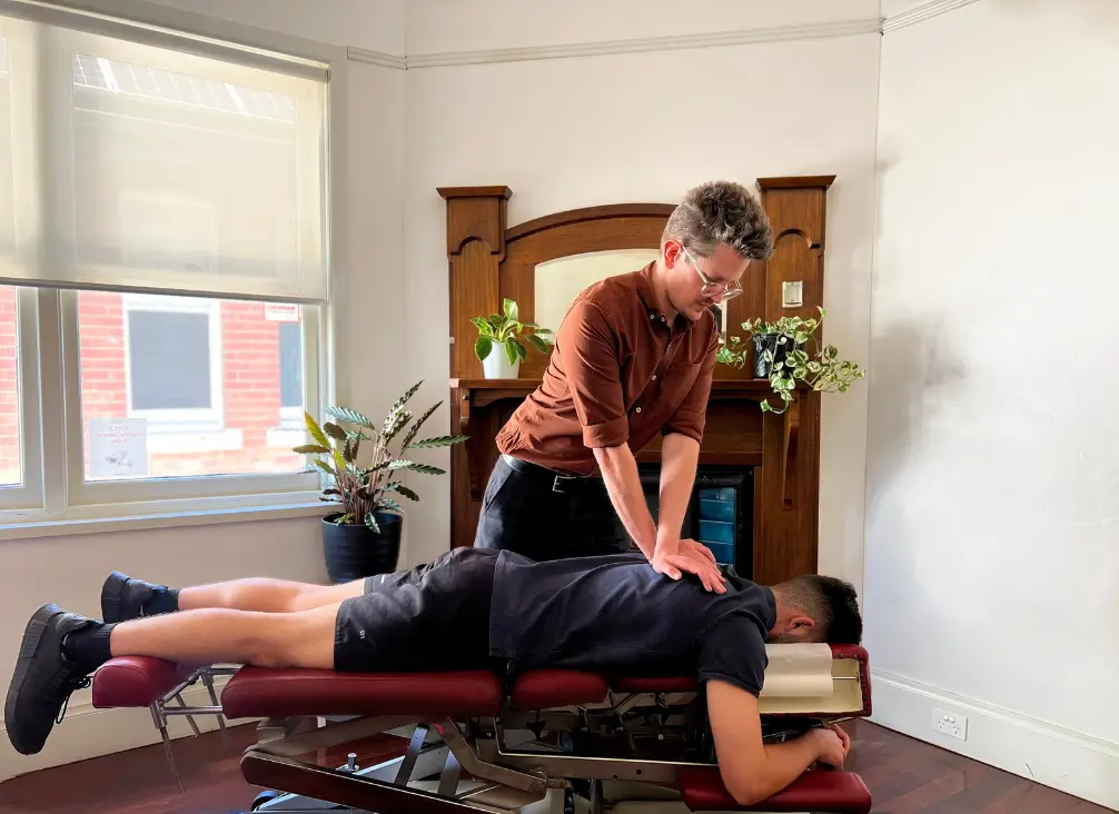 Chiropractor Melbourne performing spinal adjustment on patient