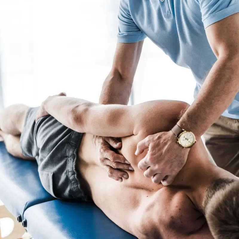 Melbourne chiropractor treating shoulder pain with hands-on adjustment