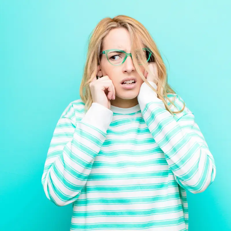 Woman with jaw tension and TMJ pain seeking Chiropractor Melbourne