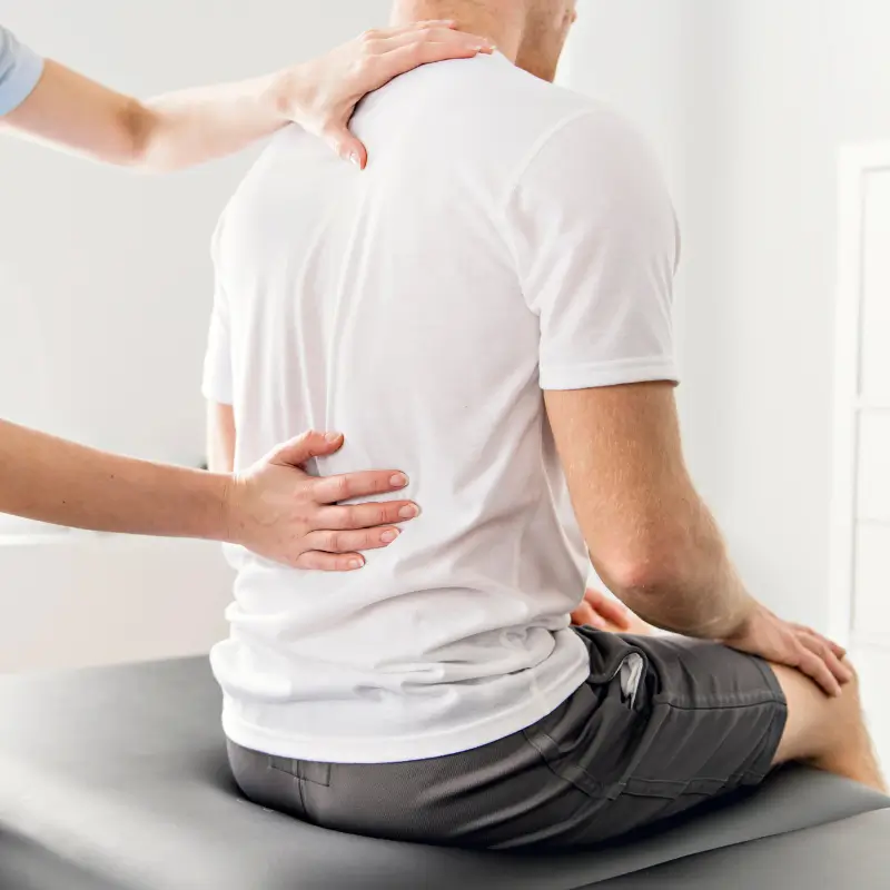Chiropractor Melbourne assessing lower back pain from disc bulge