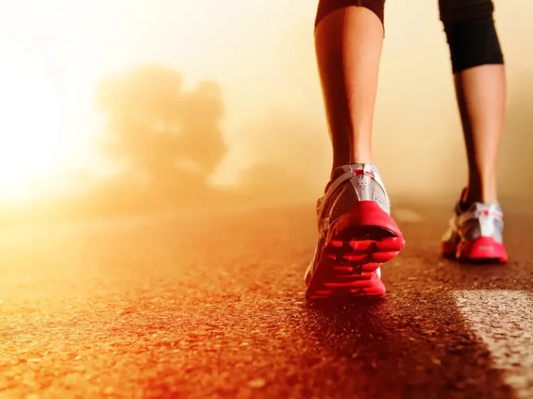 Runner in red sports shoes representing sports chiropractic care and injury treatment in Melbourne