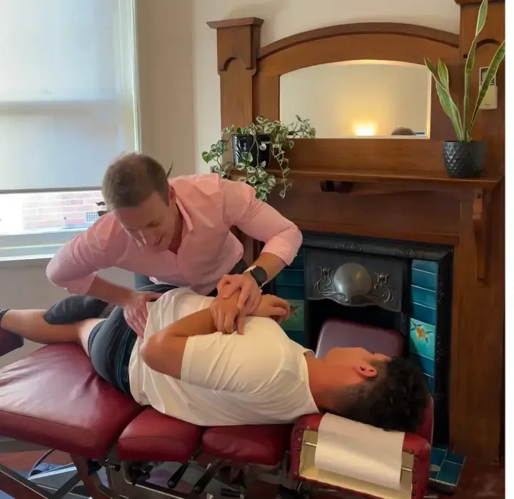 Chiropractor performing spinal disc decompression treatment on patient at Brunswick West Melbourne clinic