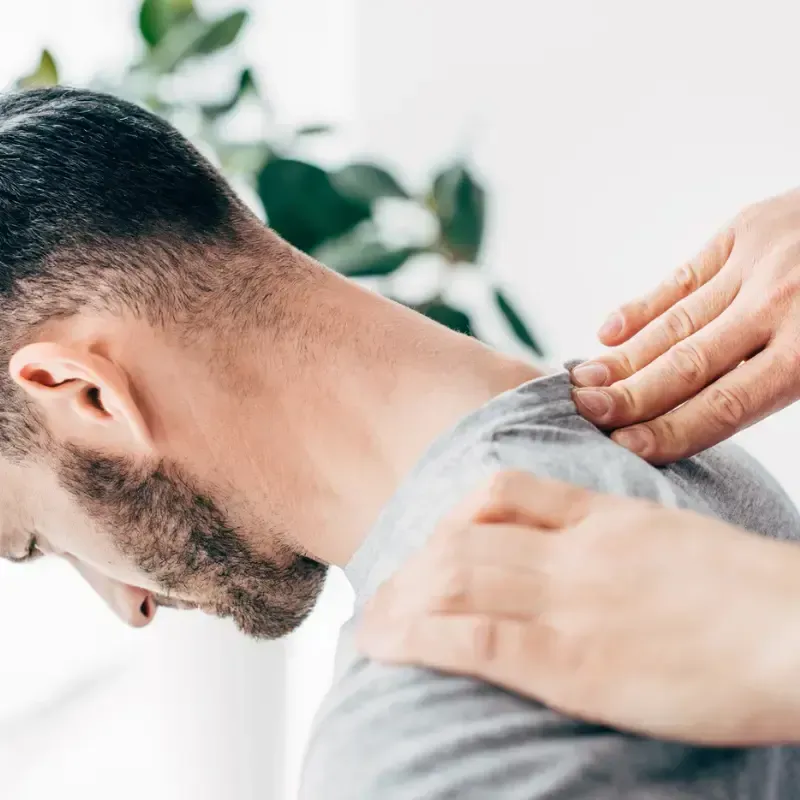 Chiropractor performing a neck adjustment at the Brunswick West clinic
